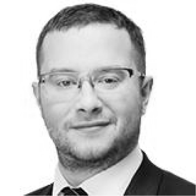 Headshot of Nino Tlapak, greyscale